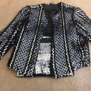 Sequined jacket with matching crop top.